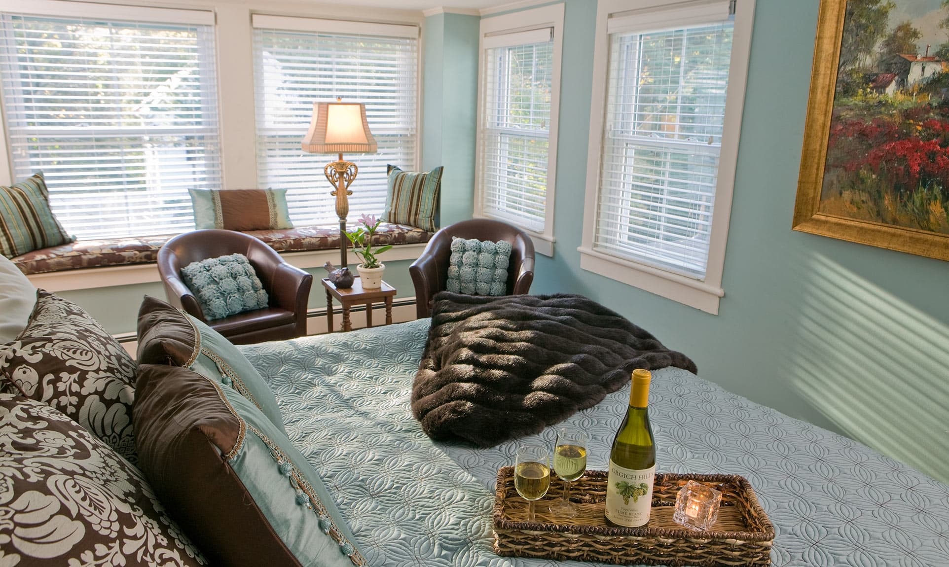 Bed with wine in the Sweet Woodruff room at our Maine coast B&B