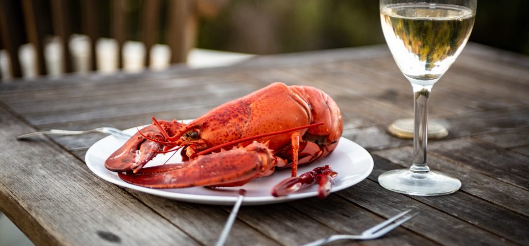 Cooked Lobster with glass of white wine